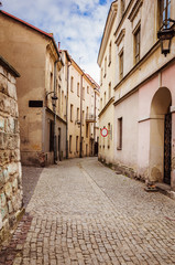 Fototapeta na wymiar Narrow street in the central part if the European city