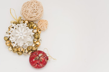 Christmas gift box with ribbon bow  and ball toy and cone on white wooden vintage background