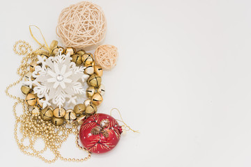 Christmas gift box with ribbon bow  and ball toy and cone on white wooden vintage background