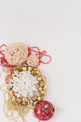 Christmas gift box with ribbon bow  and ball toy and cone on white wooden vintage background