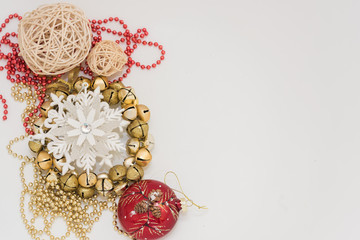 Christmas gift box with ribbon bow  and ball toy and cone on white wooden vintage background