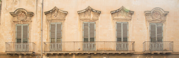Fototapeta na wymiar Lecce, Italy - Old windows in baroque style