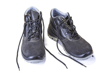 Working shoes with steel plate to protect toes on white