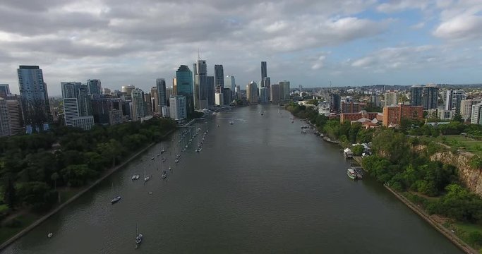 Jet skis on Brisbane river with city background