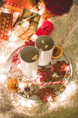 Hot chocolate drink with biscuits under the christmas tree