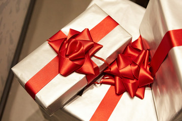 Christmas presents decorated with red ribbons. 