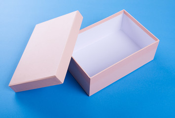 Pink shoe box on blue background.