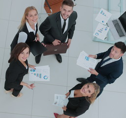 Business team studying and discussing documents