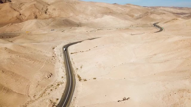 Desert road - Aerial footage of a new two lane road surrounded by dry desert landscape