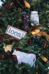 Christmas tree decorated with grapes, corn, local and farm to table signs