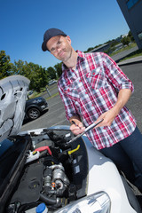 Fototapeta na wymiar male mechanic inspecting car engine