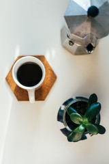 Coffee maker and coffee in mug