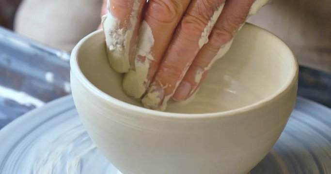 close up of old craftsman handmade clay and mold to create home-made jars and artwork. Concept of: handcraft, tradition, handmade artwork, creativity.