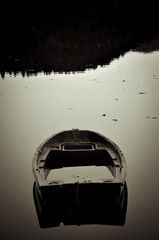Boat about to Sink in the Middle of a Lake