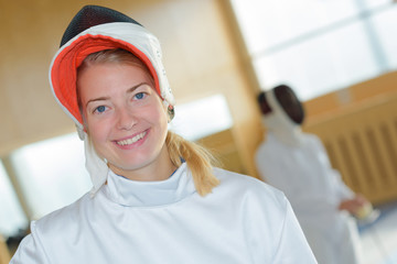 fencer posing and smiling