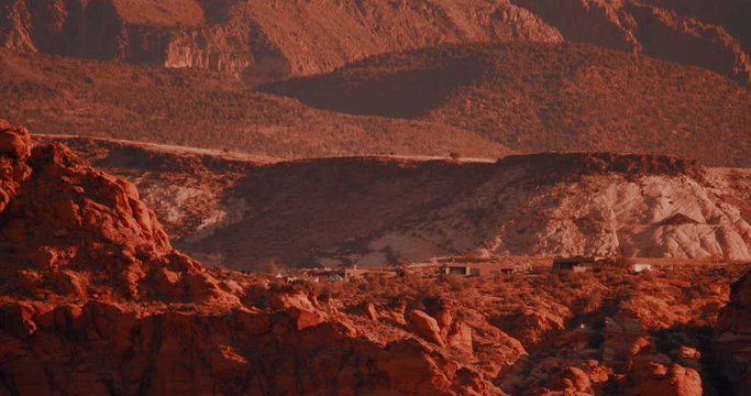 Badlands of Southern Utah. Coloring designed to mimic The Martian. Close up of private settlement buildings on the ridge.