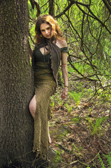 forest witch hugging a tree