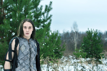 man in the suit an elf in the winter forest