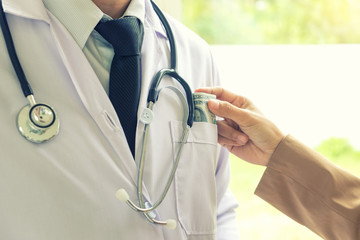 Business man or patient give bribe to the docto