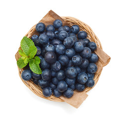 Bue berry in basket on white background