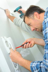 skilled entrepreneur installing new intercom system