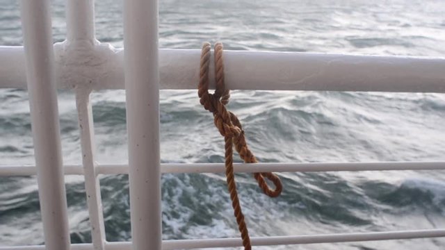 welded safety railing of a ship on the ocean