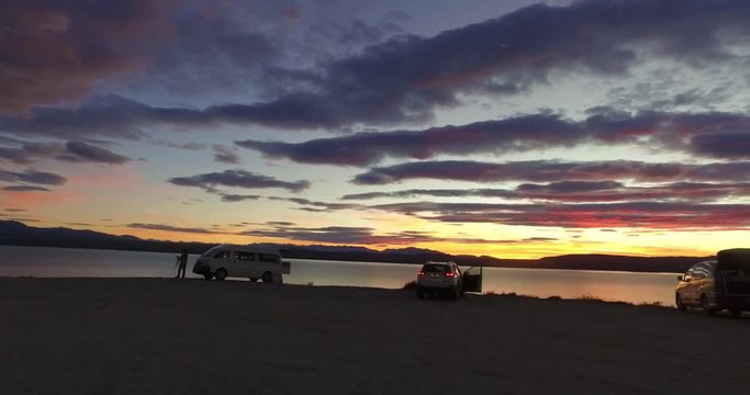 NEW ZEALAND – MARCH 2016 : Video shot of Lake Pukaki during magical sunset with cars and people in view