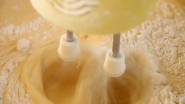 mixing  egg with flour  by whisk