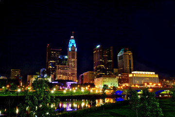 Columbus,Ohio skyline sparkles along the Scioto River with the Broad St. Bridge.