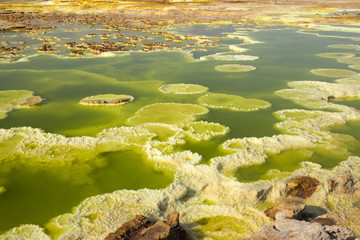 Dalol, Dankakil Depression.  Volcanic hot springs of Ethiopia. Earth’s lowest land volcano.  The craters contains hot springs that boast a whole range of otherworldly colours, including neon yellow.