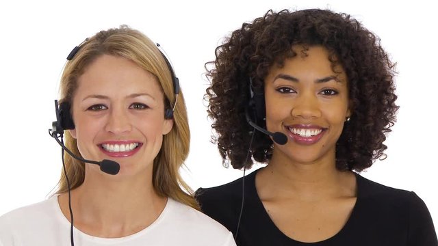 Two customer service women smiling at camera