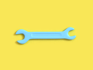 technician industry concept abstract wrench-spanner cartoon style 3d rendering yellow background