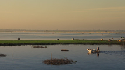 Path of Life of fisherman and farmer at river side in Amarapura Mandalay, Myanmar with wonderful sun light in the morning