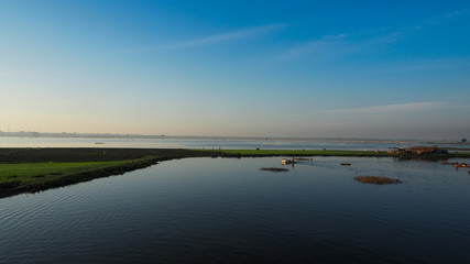 Path of Life of fisherman at river side in Mandalay, Myanmar with wonderful sun light at morning.