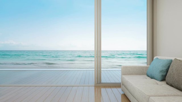 Sofa on wooden floor near glass door with ocean and sky background at luxury apartment, Lounge in sea view living room of modern beach house or hotel - Summer home interior 3d illustration
