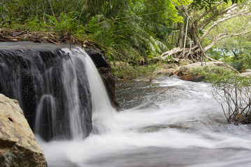 Waterfall on the river in the jungle