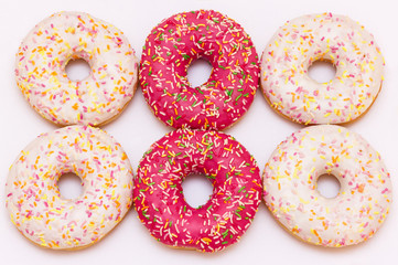 Pink glazed donuts on a white background
