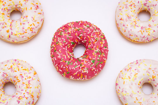 Pink glazed donuts on a white background