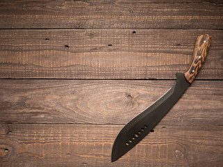 Machete on a wooden table