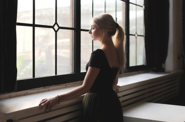 Ballerina near window