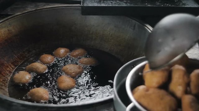 Deep fried buns in hot oil