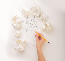 Writing hand in crumpled paper