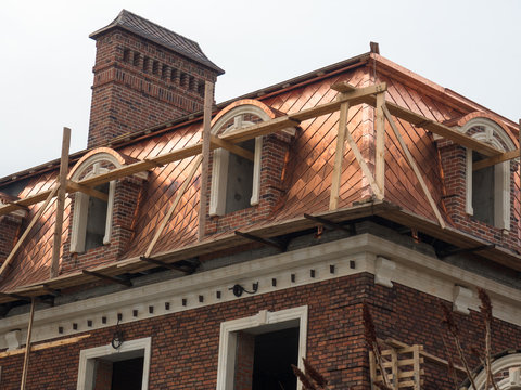 Unusual roof in a new outbuilding house