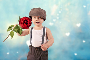 kleiner Junge mit roter Rose
