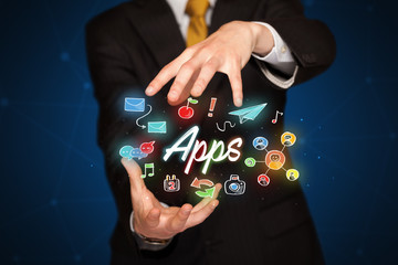Businessman holding apps