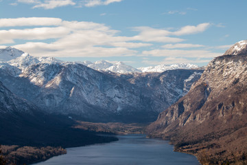 Fototapeta na wymiar Bohinj lake with snowy mountains in autumn