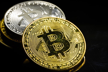 Golden bitcoin on black background with copy space cryptocurrency mining concept 