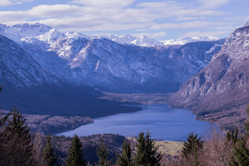 Bohinj lake with snowy mountain around