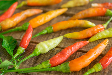 chili, pepper on old table wood background