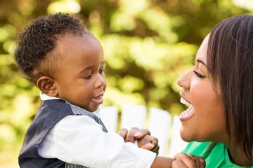 Happy African American mother and son.